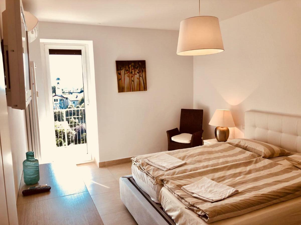 Attico Palazzo Di Vetro Apartment Luino Exterior foto